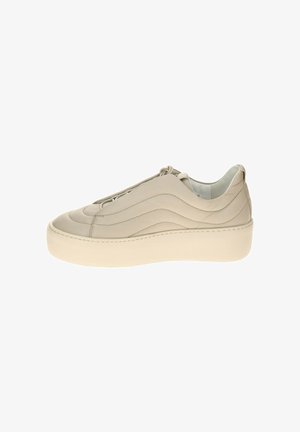 Beige leather sneaker featuring wavy stitching, slip-on design, and a thick cream-colored rubber sole. Smooth texture with minimal accents.