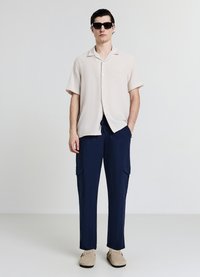 Calliope UNITA - Pantalon cargo - blu navy