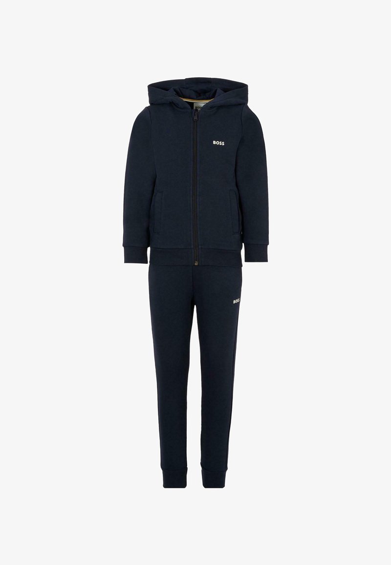 Set di tuta navy composto da giacca con zip e cappuccio e pantaloni con vita elastica. Realizzato in morbido tessuto, decorato con sottili dettagli del logo.