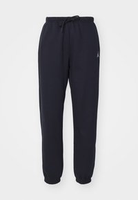 Marineblaue Jogginghosen aus weichem, dehnbarem Stoff; mit elastischem Bund und Kordelzug, gerippten Bündchen und kleinem Logoakzent.