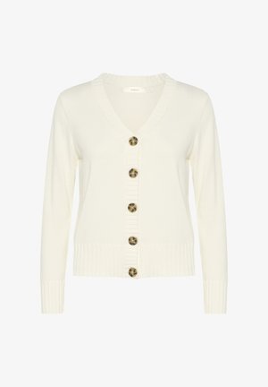 Balta adīta džempera veste ar garām piedurknēm, V formas kaklu un septiņām apaļām brūnām pogām priekšā. Ribu apakšdaļa un piedurkņu gali. Mīksta tekstūra.