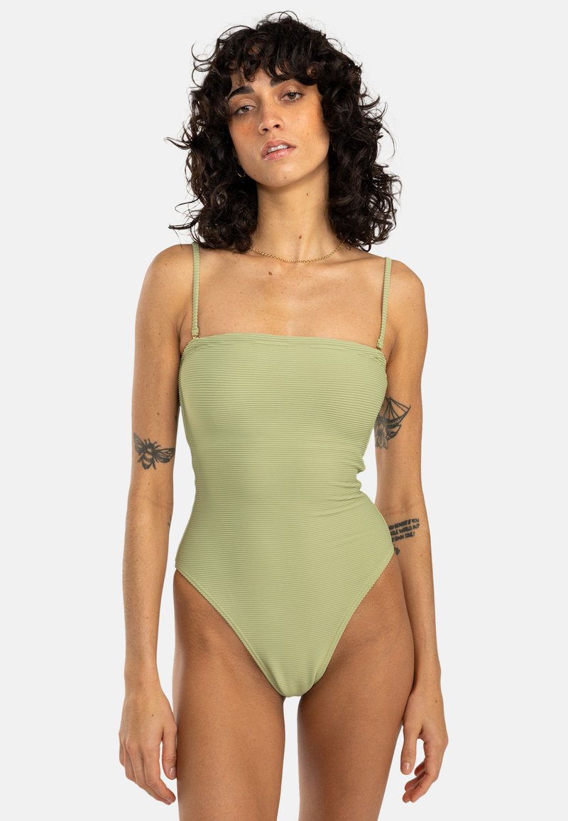Maillot de bain une pièce en tissu côtelé vert clair, avec de fines bretelles réglables, un décolleté carré et une coupe de jambe haute.