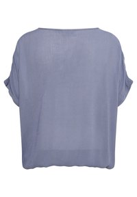 Blouse à manches courtes, ample, en lavande douce avec un large col rond et un ourlet légèrement froncé, vue de dos.