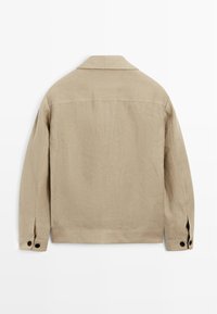 Beige Leinenjacke mit klassischem Kragen, langen Ärmeln, geknöpften Manschetten und geradem Schnitt. Strukturierter Stoff mit minimalen Nähten.