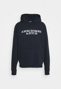 Felpa blu navy con tasca frontale, caratterizzata dal logo del testo bianco "ABERCROMBIE & FITCH". Realizzata in morbido cotone, con polsini a costine.