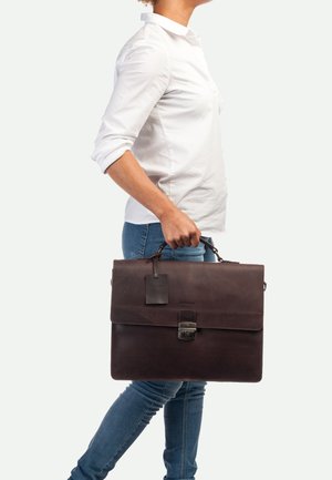 Brown leather briefcase with a flap closure, metal clasp, and a luggage tag. Smooth texture and structured design for professional use.