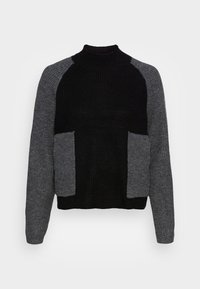 Svart och grå stickad tröja med hög halsringning, raglanärmar och två framfickor. Ribbad struktur med kontrasterande färgblock.