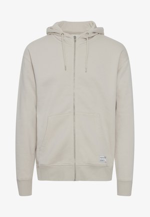 Hellbeige Zip-up-Hoodie mit Kapuze, Fronttaschen, gerippten Bündchen und Saum. Aus weichem Stoff gefertigt, mit verstellbaren Kordelzügen und Logopatch.