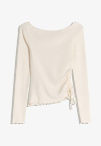 Jasno-beżowa bluzka z długim rękawem, wykonana z miękkiego materiału, z okrągłym dekoltem, marszczeniem po bokach z wiązaniami i falbanką na dole.