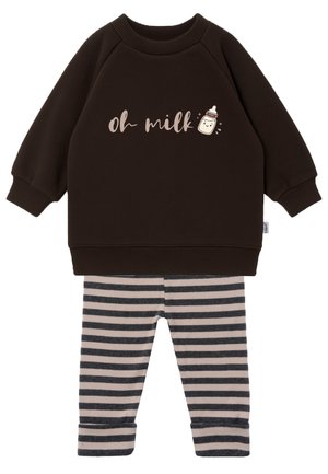 Dark brown long-sleeve baby top with "oh milk" text and baby bottle graphic, paired with black and beige striped leggings.