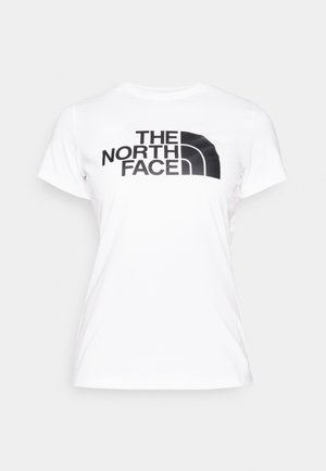 Hvit bomull t-skjorte med svart grafisk trykk av "THE NORTH FACE"-logoen foran. Korte ermer og rund hals.