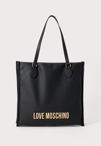 Must mustkott, mis on valmistatud siledast ja läikivast materjalist, kahe ümmarguse käepidemega. Altosas on metallik kuldne "LOVE MOSCHINO" logo.