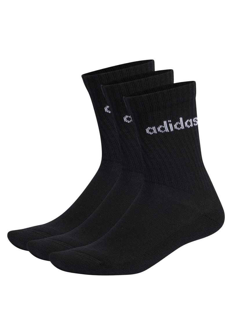 Calcetines de algodón negros con textura acanalada, que presentan el logo blanco de Adidas. Se presentan tres pares, cada uno con un diseño clásico de corte crew.