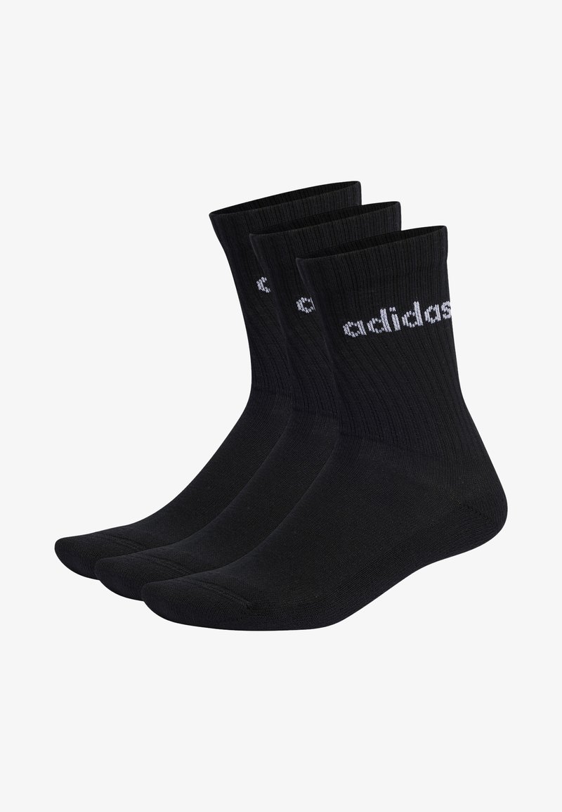 Calcetines de algodón negros con textura acanalada, que presentan el logo blanco de Adidas. Se presentan tres pares, cada uno con un diseño clásico de corte crew.