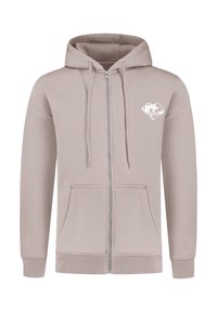 Felpa leggera beige con zip, dotata di tasca frontale e cordini. Presenta una leggera grafica bianca nella zona sinistra del petto. Materiale morbido, design casual.