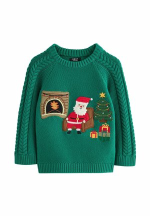 Pull vert en laine pour enfants avec un motif de Noël montrant le Père Noël, une cheminée, un sapin décoré et des cadeaux emballés.