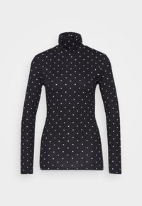 Svart långärmad polo tröja i elastiskt tyg, med ett mönster av vita prickar jämnt fördelade över ytan.