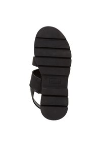 Black sandal bottom featuring textured rubber sole with horizontal grooves, adjustable straps, and embossed brand logo. Size 37.