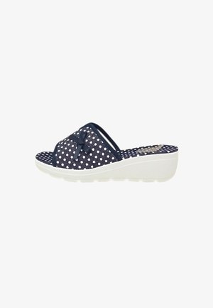 Sandalo slip-on con zeppa blu navy con pois bianchi, piccolo fiocco sulla cinghia e suola bianca strutturata.