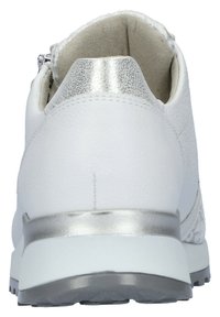 White leather sneaker with textured silver accents and a padded collar. The sole is white with traction patterns for grip. Zip closure at the back.