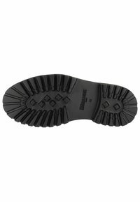 Semelle extérieure en caoutchouc noir dotée de crampons profonds et d'une surface texturée. Comprend des motifs en diamant et en croix pour une meilleure adhérence et stabilité.
