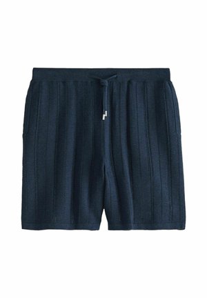 Tengerészkék kötött rövidnadrág függőleges bordázott textúrával, rugalmas derékrésszel és fémhegyű húzózsinórral.