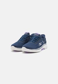 Navy mesh sneakers with white and purple accents, featuring a lace-up design, perforated upper for breathability, and cushioned sole.