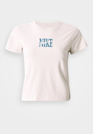 Short-sleeve white cotton t-shirt featuring blue embroidered "NIKE" logo at center. Crew neck with a regular fit. Soft texture.