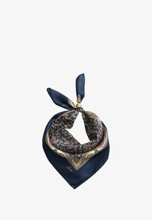 Svileni šal tamnoplave boje s paisley uzorkom u zelenoj, crvenoj i krem boji, zavezano u labavu čvor pokazuje trokutasti oblik.