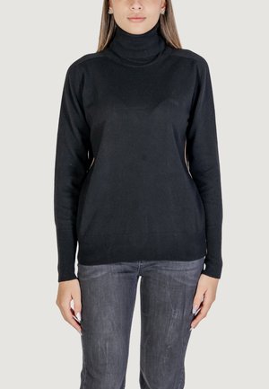 Pull à col roulé noir en matière tricotée douce, doté de manches longues et de poignets côtelés, avec une texture lisse.
