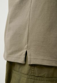 Next Pólóing - neutral brown
