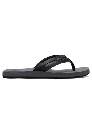 Tongs noires avec une semelle en caoutchouc souple, présentant deux brides texturées, un détail de logo prononcé et un pied plat lisse.
