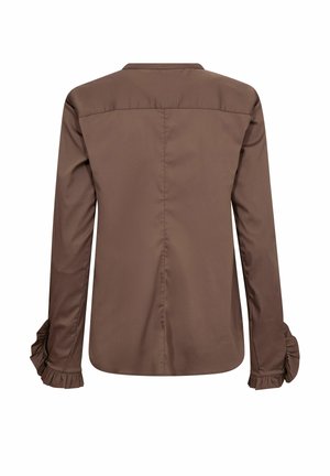 Hnedá blúzka s dlhými rukávmi, volánikmi na manžetách a so zvlneným zadným švom, zobrazená na bielom pozadí.