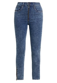 Jeans de tiro alto de lavado ácido azul con cremallera frontal, cierre de botón, bolsillos frontales y cremalleras en los puños de los tobillos.