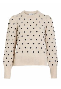 Pull beige en tricot avec des pois noirs en relief, col rond côtelé, poignets et ourlet côtelés, doté de manches longues bouffantes.