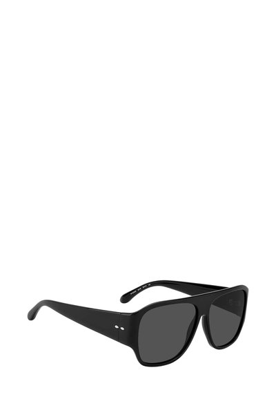 Occhiali da sole oversize neri con montatura spessa e lenti scure inclinati su sfondo bianco.