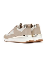 Light beige sneakers with smooth leather and quilted accents, metallic heel trim, and a white midsole. Rubber sole for traction.