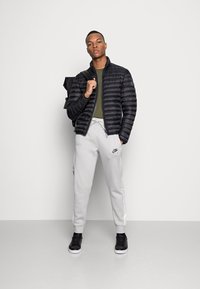 Nike Sportswear Calças de fato de treino - phantom