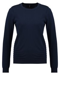 Marineblauer Pullover mit langen Ärmeln und rundem Halsausschnitt, der seitliche, vertikale Ripp-Details für Textur und Gestaltung bietet.