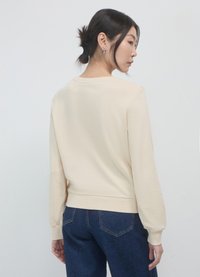 Calliope Felpa - crema