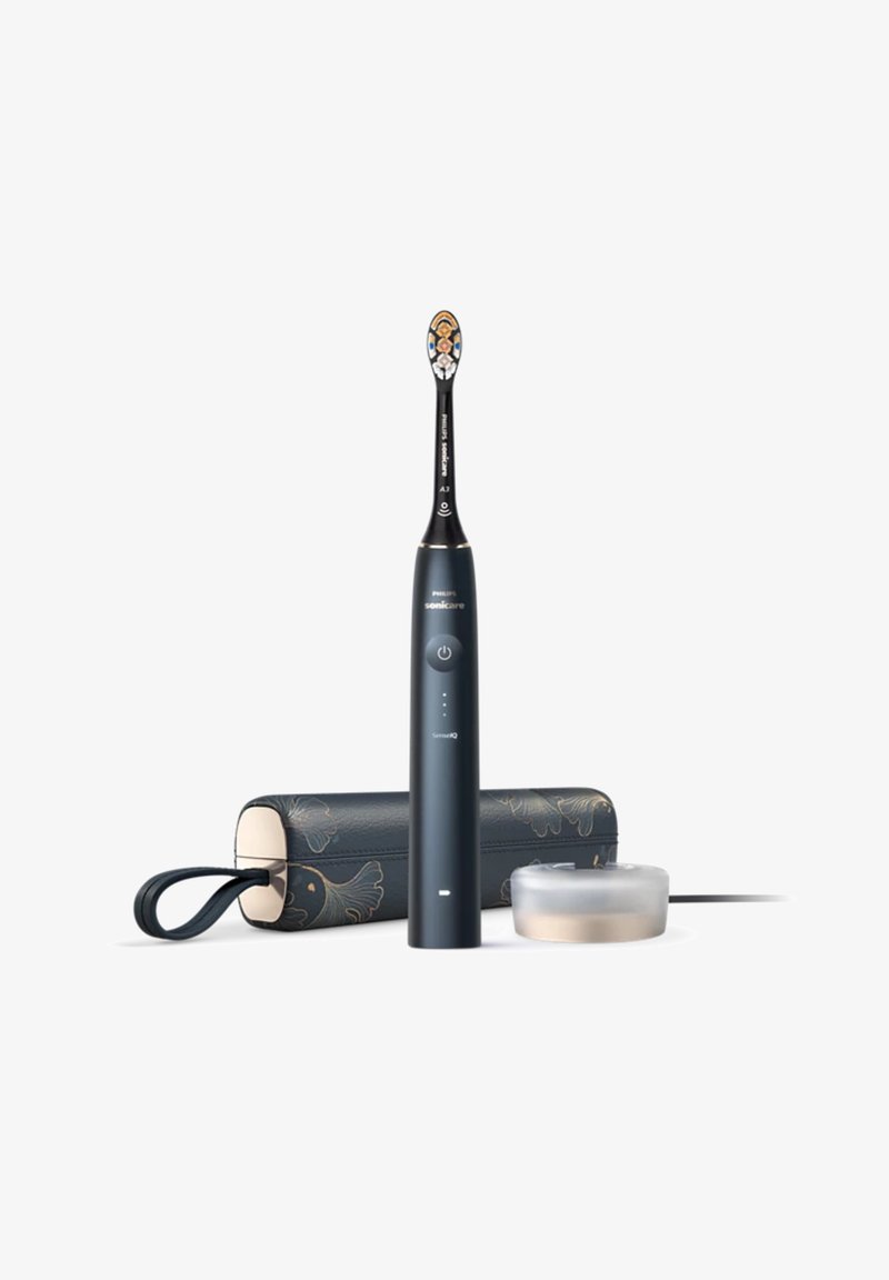 Philips Sonicare elektrische Zahnbürste, schwarz mit einem gemusterten Ladeetui und klarem Sockel, zeichnet sich durch ein ergonomisches Design und einen Steuerknopf aus.