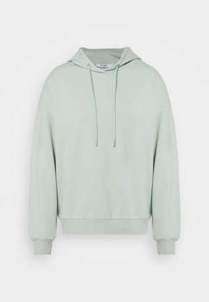 Felpa verde chiaro con cappuccio regolabile, maniche lunghe e polsini a costine. Materiale in cotone morbido, vestibilità rilassata e design minimalista.