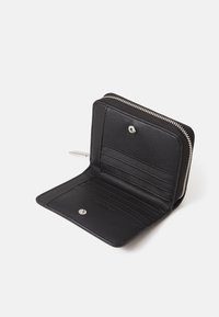 Black leather wallet with a zippered closure, multiple card slots, and a smooth texture. Features a snap button for secure fastening.