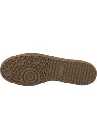 Suola di scarpa in gomma marrone con una trama a motivo. Presenta dettagli circolari e sezioni testurizzate per una maggiore aderenza. Profilo piatto con una finitura liscia.