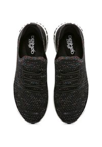 Black athletic shoes with a textured knit upper, featuring multicolored flecks, black laces, and a white outsole with a speckled design.