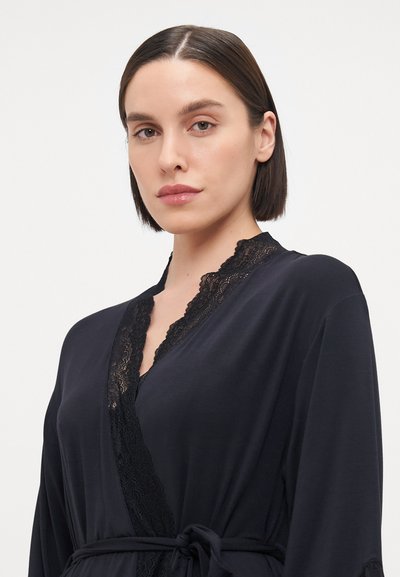 Black robe featuring lace detail along the neckline and cuffs, with a tie belt at the waist and a smooth, soft texture.