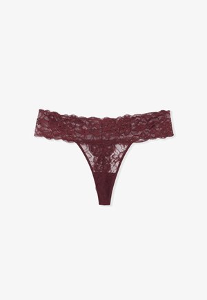 String en dentelle bordeaux avec motif floral, doté d'une large taille en dentelle et d'un design à couverture minimale. Confectionné en tissu doux et transparent.