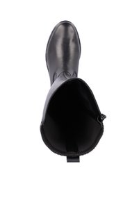 Bottine en cuir noir avec un extérieur lisse, un bout arrondi, une fermeture éclair sur le côté et une doublure texturée à l'intérieur.