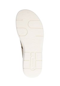 Shoe sole with a white rubber base featuring a textured pattern for grip and a rounded heel. Light brown upper edges visible at the sides.