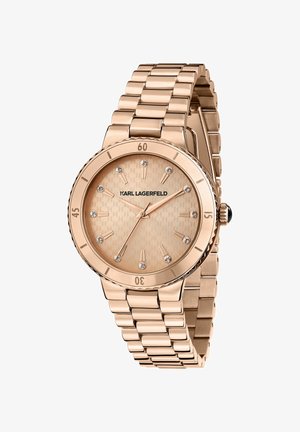 Orologio in oro rosa con quadrante testurizzato, indici delle ore incastonati e bracciale a maglie. Caratterizzato da una lunetta girevole e un'accento di corona nera.